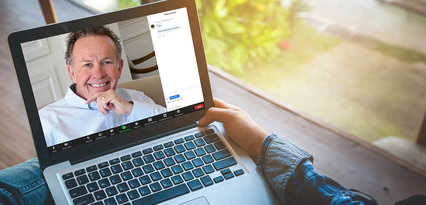 Image of Dr. Marx on a laptop screen tele meeting.